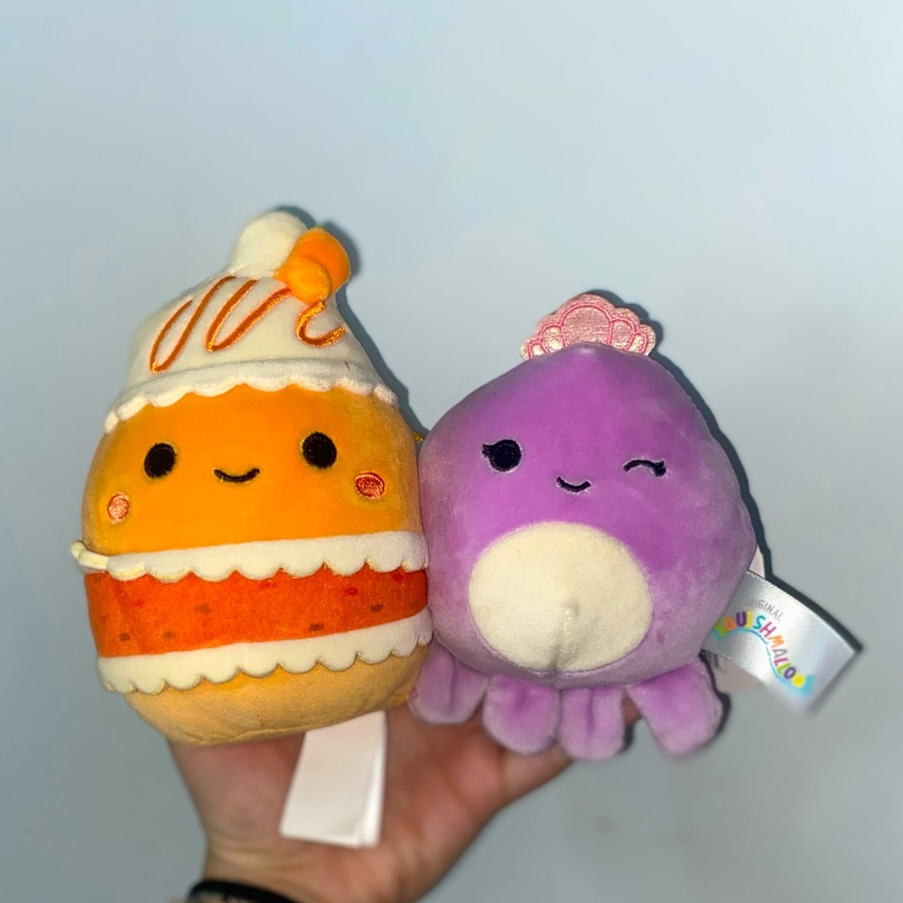 2 Medium squishmallows. Scooter the Carrot Cake 🍰 and Violet the Octopus 🐙
